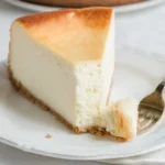 Glass bowl with graham cracker crumbs, sugar, and melted butter for New York Cheesecake crust